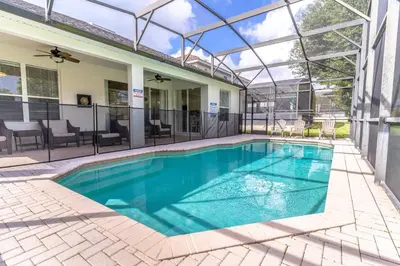 a swimming pool in a house with a glass roof at 7741 Windsor Hills in Orlando
