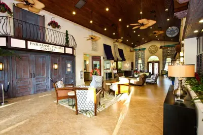 a lobby of a hotel with chairs and tables at 3085 Paradise Palms in Kissimmee
