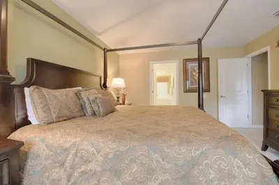 a bedroom with a large bed and a dresser at 2540 Windsor Hills in Orlando