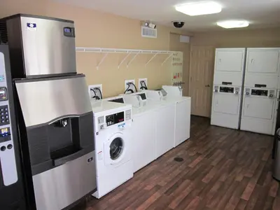 a large laundry room with a washer and dryer at Extended Stay America Suites - Orlando - Lake Buena Vista in Orlando