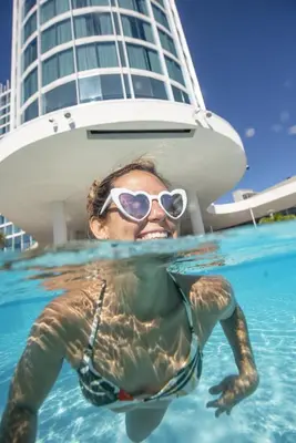 a man in the water in front of a boat at Universal's Aventura Hotel in Orlando