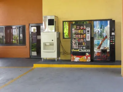 a gas station with a pay phone and a refrigerator at Budget Inn Of Orlando in Orlando