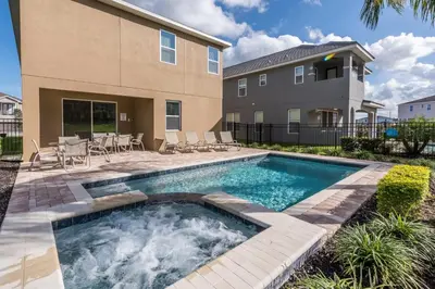 a swimming pool in the backyard of a house at Inviting Home With Private Pool Near Disney With Water Park & Resort Access At Encore Resort - 7498Mr in Kissimmee