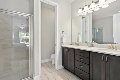 a bathroom with a sink and a shower at Beautiful Home With Private Pool, Media & Game Room Near Disney With Waterpark And Resort Access At Encore Resorts Reunion - 210Cl in Kissimmee