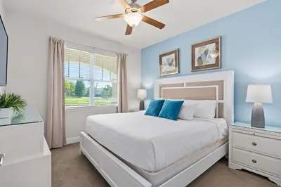 a bedroom with a bed and a ceiling fan at Beautiful Home With Private Pool, Media & Game Room Near Disney With Waterpark And Resort Access At Encore Resorts Reunion - 210Cl in Kissimmee