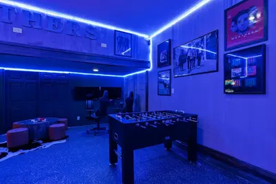 a room with a ping pong table in a room at Beautiful Home With Private Pool, Media & Game Room Near Disney With Waterpark And Resort Access At Encore Resorts Reunion - 210Cl in Kissimmee