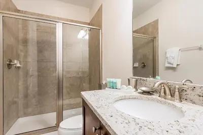 a bathroom with a sink and a shower at Elegant Home Near Disney With Private Pool And Waterpark & Resort Access At Encore Resorts Reunion - 391Fl in Kissimmee