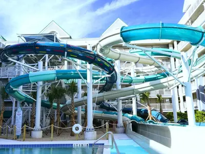 a water slide at a resort with a pool at Holiday Inn Resort Orlando Suites - Waterpark by IHG in Orlando