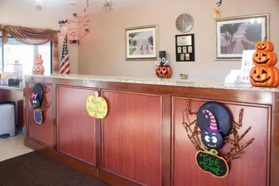 a bar with pumpkins and decorations on it at Villas at Fortune Place in Kissimmee