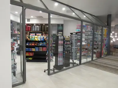 a store with sliding glass doors in a store at Holiday Inn Orlando International Dr-ICON by IHG in Orlando