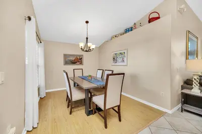 a dining room with a table and chairs at Indian Creek 3.5 miles from Disney in Orlando