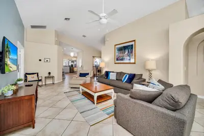 a living room with a couch and a table at Indian Creek 3.5 miles from Disney in Orlando