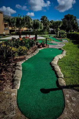 a golf course with green grass and rocks at Westgate Leisure Resort in Orlando