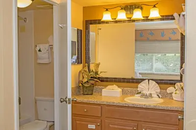 a bathroom with a sink and a mirror at Westgate Leisure Resort in Orlando