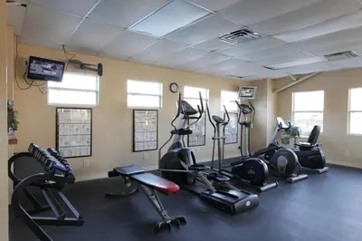 a gym with several exercise bikes in a room at Orlando RV Resort in Orlando