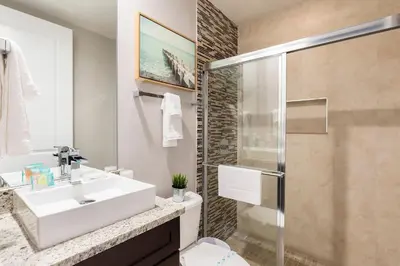 a bathroom with a sink and a shower at Summerville Vacation Resort in Orlando
