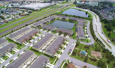 an aerial view of a city with a lake at Four Bedrooms Townhouse 5102 in Kissimmee