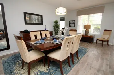 a dining room with a table and chairs at Cayview Condo #231537 in Orlando