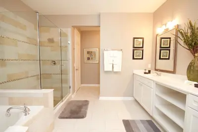 a bathroom with a shower and a sink and a tub at Cayview Condo #231536 in Orlando