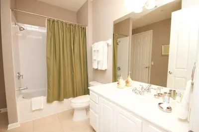 a bathroom with a sink and a toilet and a shower at Cayview Condo #231536 in Orlando