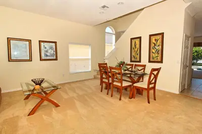 a dining room with a table and chairs at Morningstar Villa #230785 in Orlando