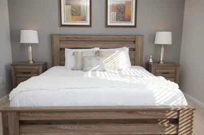 a bedroom with a large bed with two lamps at Cayview Condo #231541 in Orlando