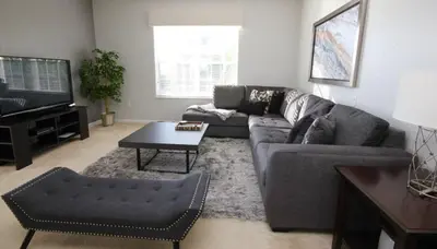 a living room with a couch and a table at Cayview Condo #231541 in Orlando