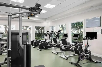 a gym with treadmills and elliptical machines at Marriott's Cypress Harbour Villas in Orlando