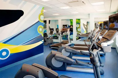 a gym with cardio machines and treadmills at Fairfield Inn Suites by Marriott Orlando At SeaWorld in Orlando