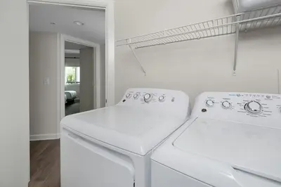 a white laundry room with a washer and dryer at Marriott's Imperial Palms Villas in Orlando
