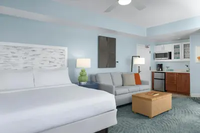 a hotel room with a bed and a couch at Marriott's Harbour Lake in Orlando