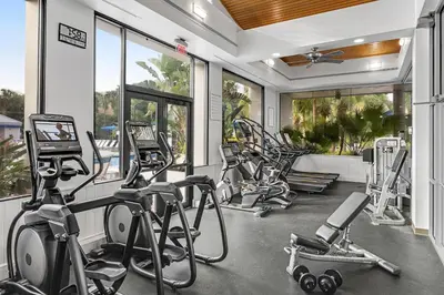 a gym with several treadmills and elliptical machines at Marriott's Royal Palms in Orlando