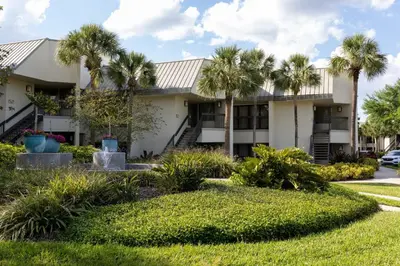 a building with palm trees in front of it at Marriott's Sabal Palms in Orlando