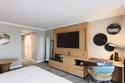 a hotel room with a bed and a television at JW Marriott Orlando Grande Lakes in Orlando