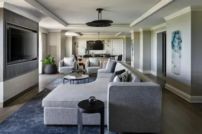 a living room with a couch and a tv at JW Marriott Orlando Grande Lakes in Orlando