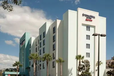 a rendering of the exterior of a hotel at SpringHill Suites Orlando Airport in Orlando