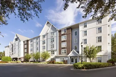 an exterior view of a large apartment building at TownePlace Suites by Marriott Orlando East/UCF Area in Orlando