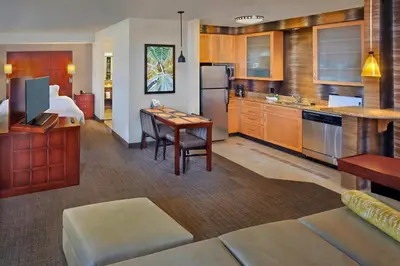 a room with a kitchen and a living room at Residence Inn Orlando Lake Mary in Lake Mary
