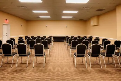 a room with rows of chairs in a classroom at Radisson Hotel Orlando Lake Buena Vista South in Kissimmee