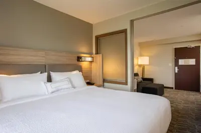 a large white bed in a hotel room at SpringHill Suites Orlando Altamonte Springs/Maitland in Orlando