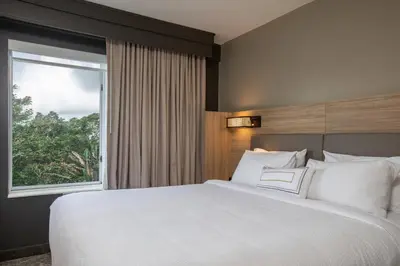 a bedroom with a large white bed with a window at SpringHill Suites Orlando Altamonte Springs/Maitland in Orlando