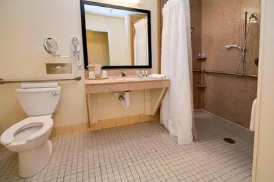 a bathroom with a toilet and a sink and a shower at Fairfield Inn & Suites by Marriott Clermont in Clermont