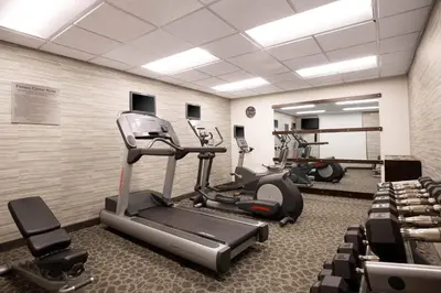 a gym with treadmills and elliptical machines at Courtyard by Marriott Orlando Lake Mary North in Lake Mary