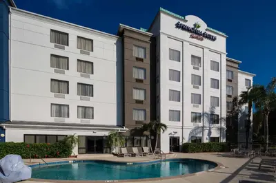 a hotel with a pool in front of it at SpringHill Suites by Marriott Orlando North-Sanford in Sanford