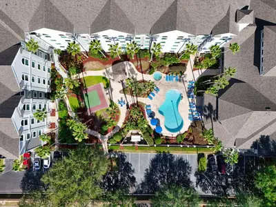 an aerial view of a resort with a swimming pool at Lake Buenavista Apartments close to Disney in Orlando