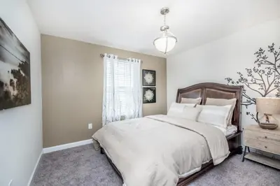 a bedroom with a bed and a window at King Castle Circle Villa #237082 in Kissimmee