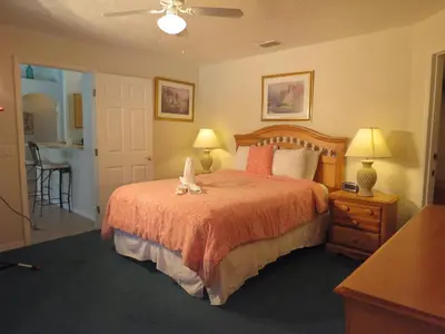 a bedroom with a bed with two stuffed animals on it at 3 Bedroom Standard Davenport Home FL 33897 in Orlando
