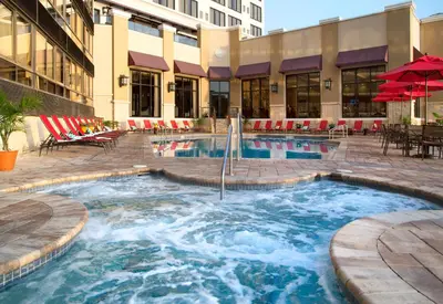 a swimming pool in the middle of a building at Plaza Suites On International Drive Near Universal Epic in Orlando