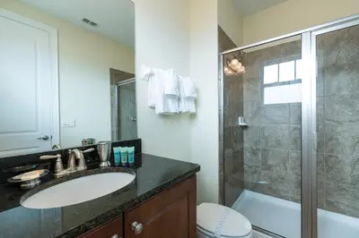a bathroom with a sink and a shower at Wilmington Loop 6 Br Luxury Villa with Pool and Spa in Orlando