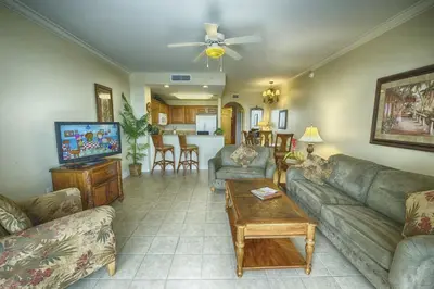 a living room with a couch and a table at Condo Blue Heron in Orlando